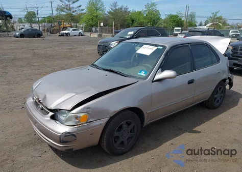 1999 Toyota Corolla Le z USA, uszkodzony, nr VIN 2T1BR12E2XC192065